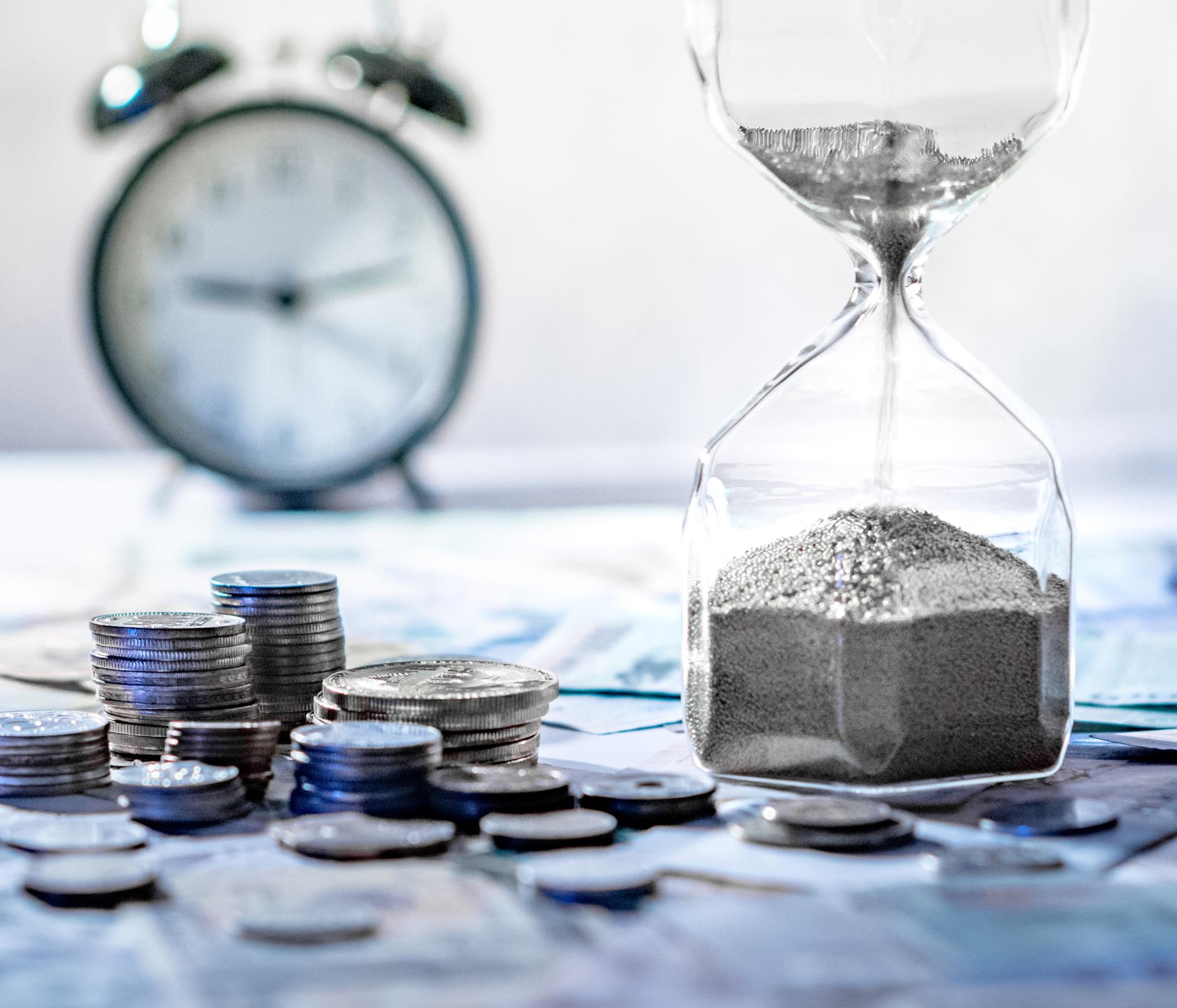 Picture of clock, hourglass and coins